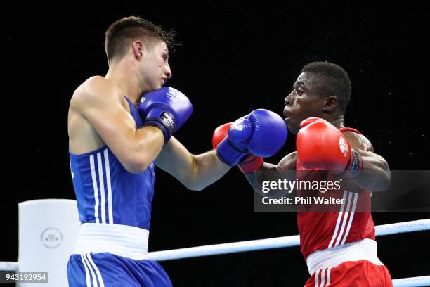 Nkumbu Silungwe of Zambia and Williams Edwards of Wales compete in the Mens Light Welter during Boxing on day four of the Gold Coast 2018...