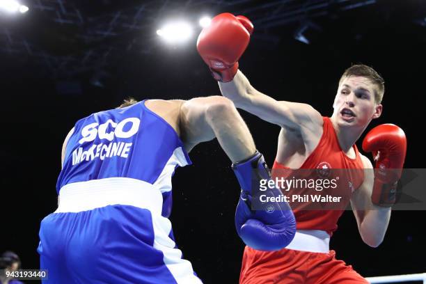 Thomas Blumenfeld of Canada and Robbie McKechnie of Scotland compete in the Mens Light Welter during Boxing on day four of the Gold Coast 2018...