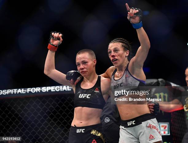 Opponents Rose Namajunas and Joanna Jedrzejczyk of Poland embraces after the conclusion of their women's strawweight title bout during the UFC 223...