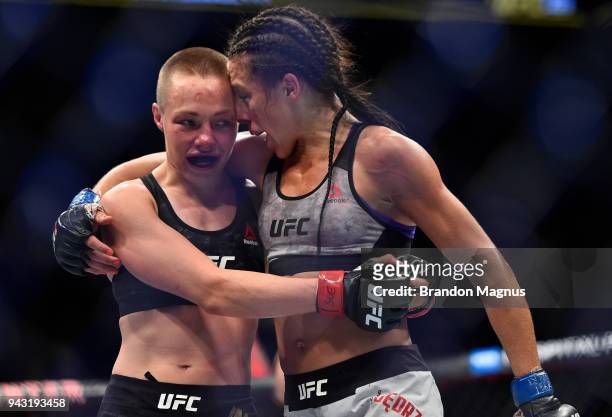 Opponents Rose Namajunas and Joanna Jedrzejczyk of Poland embraces after the conclusion of their women's strawweight title bout during the UFC 223...
