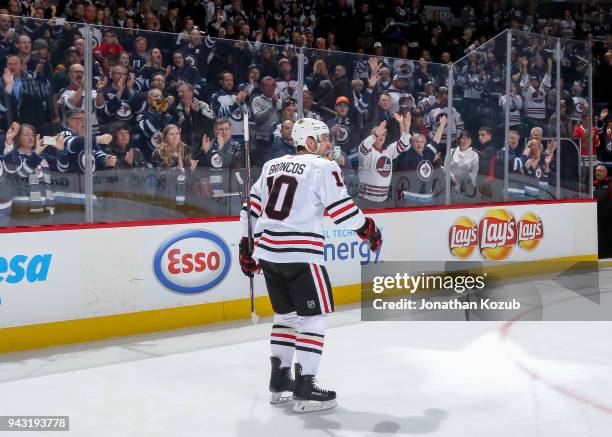 Patrick Sharp of the Chicago Blackhawks leaves the ice after receiving third star honours following the Jets 4-1 victory over the Hawks at the Bell...