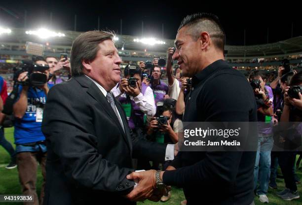 Miguel Herrera, coach of America and Ignacio Ambriz coach of Necaxa shake hands prior the 14th round match between Necaxa and America as part of the...