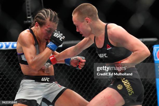 Strawweight champion Rose Namajunas and Joanna Jedrzejczyk trade punches during their UFC women's strawweight championship bout at UFC 223 at...