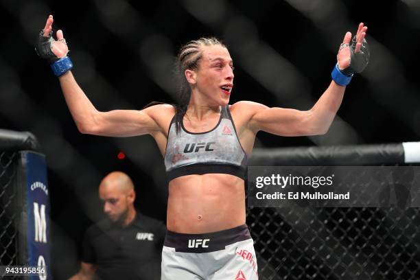 Joanna Jedrzejczyk reacts in between rounds of her UFC women's strawweight championship bout at UFC 223 at Barclays Center on April 7, 2018 in New...