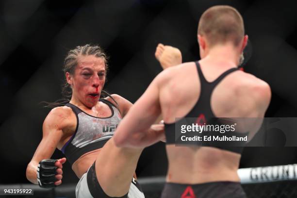 Joanna Jedrzejczyk throws a kick at UFC strawweight champion Rose Namajunas during their UFC women's strawweight championship bout at UFC 223 at...