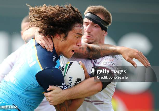 Kevin Proctor of the Titans tries to break through a tackle during the round five NRL match between the Gold Coast Titans and the Manly Sea Eagles at...