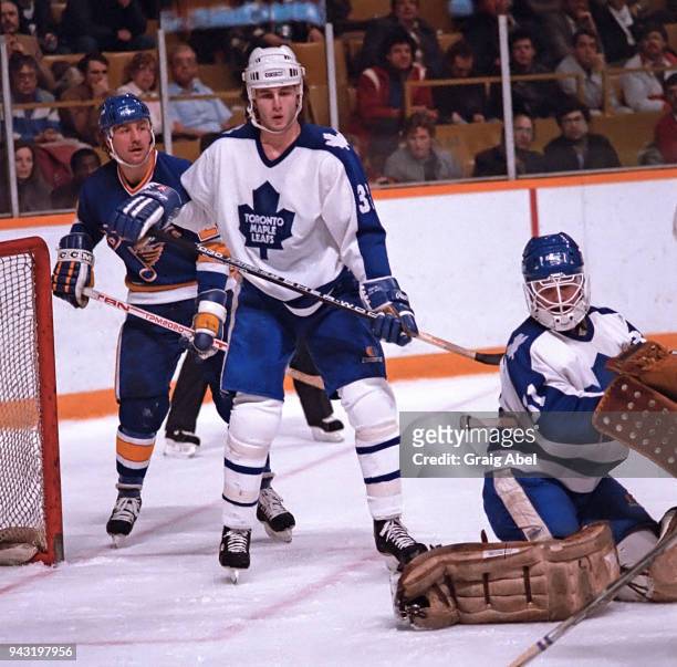 Ken Wregget and Al Iafrate of the Toronto Maple skate against Bernie Federko of the St. Louis Blues during game action on December 11, 1985 at Maple...