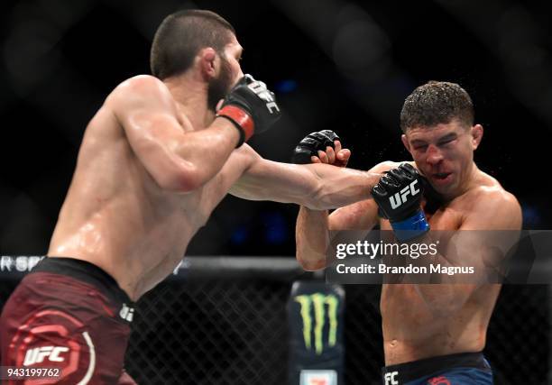 Khabib Nurmagomedov of Russia punches Al Iaquinta in their lightweight title bout during the UFC 223 event inside Barclays Center on April 7, 2018 in...