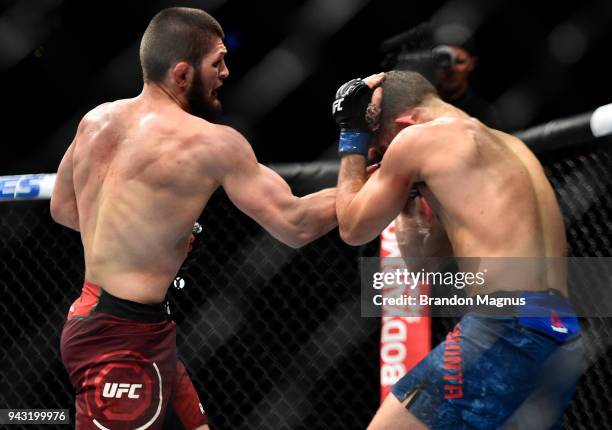 Khabib Nurmagomedov of Russia punches Al Iaquinta in their lightweight title bout during the UFC 223 event inside Barclays Center on April 7, 2018 in...