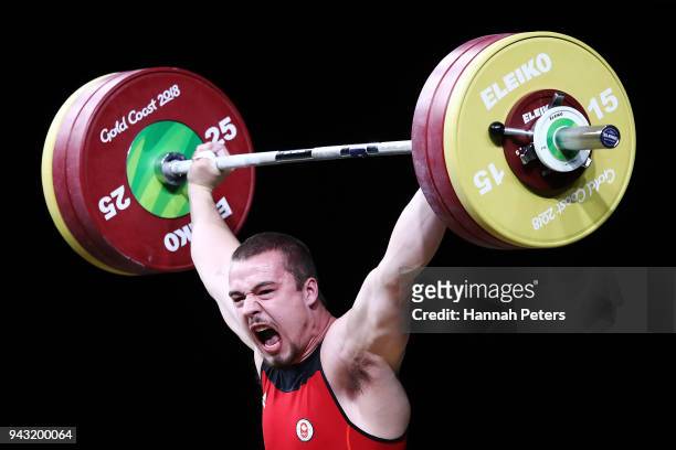 Boady Santavy of Canada competes in the Men's 94kg final during Weightlifting on day four of the Gold Coast 2018 Commonwealth Games at Carrara Sports...
