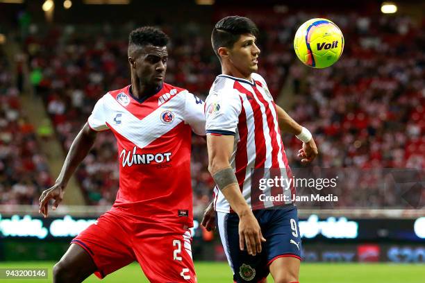 Christian Ramos of Veracruz and Alan Pulido of Chivas fight for the ball during the 14th round match between Chivas and Veracruz as part of the...
