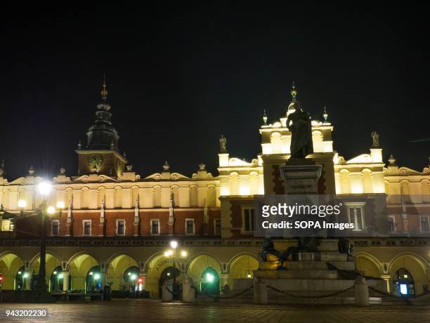 Beautiful old Sukiennice and Adam Mickiewicz Monument on the Krakow main square. The city of Krakow is located in southern Poland and it is the...