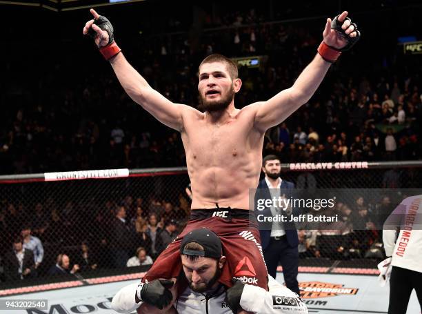 Khabib Nurmagomedov of Russia celebrates after a dominating performance over Al Iaquinta in their lightweight title bout during the UFC 223 event...