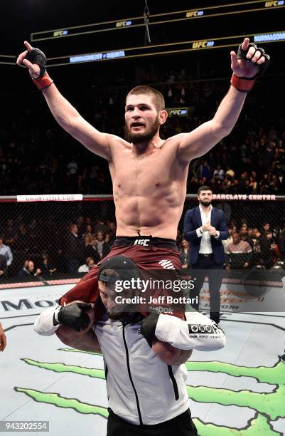 Khabib Nurmagomedov of Russia celebrates after a dominating performance over Al Iaquinta in their lightweight title bout during the UFC 223 event...