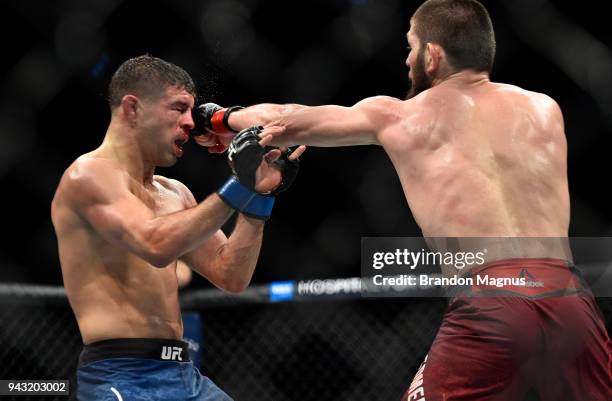 Khabib Nurmagomedov of Russia punches Al Iaquinta in their lightweight title bout during the UFC 223 event inside Barclays Center on April 7, 2018 in...