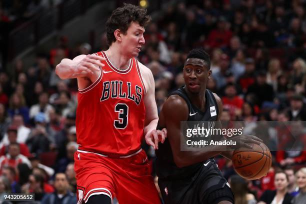 Omer Asik of Chicago Bulls in action against Caris LeVert of Brooklyn Nets during the NBA game between Brooklyn Nets and Chicago Bulls at the United...