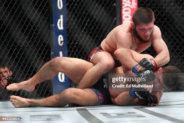 Khabib Nurmagomedov throws a punch at Al Iaquinta during their UFC lightweight championship bout at UFC 223 at Barclays Center on April 7, 2018 in...