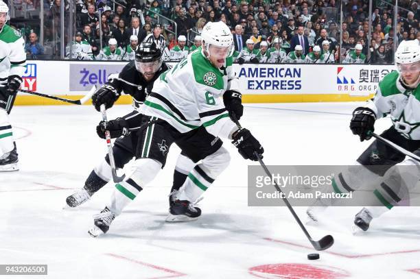 Julius Honka of the Dallas Stars handles the puck against Tobias Rieder of the Los Angeles Kings at STAPLES Center on April 7, 2018 in Los Angeles,...