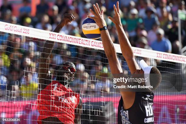 Daneil Williams of Trinidad and Tobago competes during the Beach Volleyball Men's Preliminary round against Inia Korowale and Sairusi Cavula of Fiji...