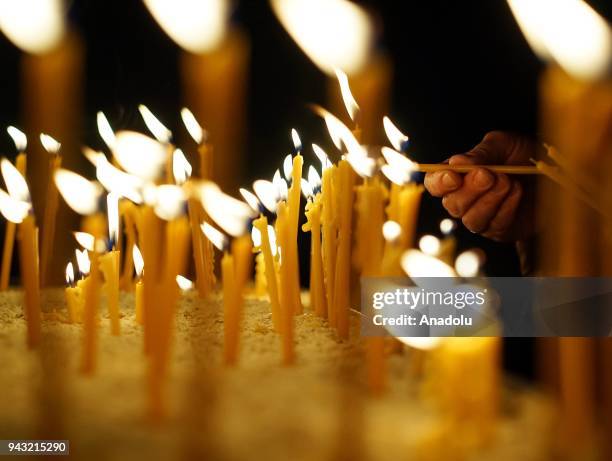 Orthodox Christians light candles before the celebration of the Orthodox Easter at Marko's Monastery near Skopje, Macedonia on April 8, 2018. The...