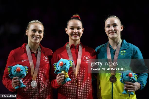 Gold medallist Canada's Shallon Olsen poses with silver medallist Canada's Elsabeth Black and bronze medallist Australia's Emily Whitehead after the...