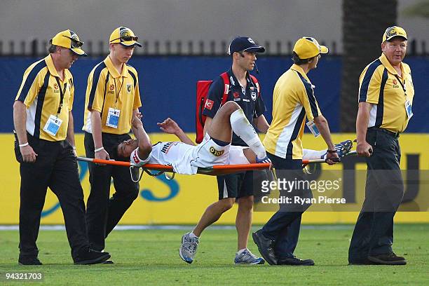 Surat Sukha of the Victory is carried from the ground with an injury during the round 18 A-League match between the Central Coast Mariners and the...