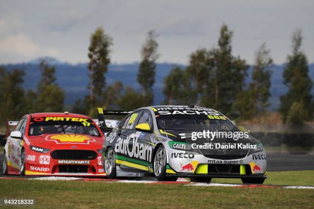 Craig Lowndes drives the Autobarn Lowndes Racing Holden Commodore ZB leads Scott McLaughlin drives the Shell V-Power Racing Team Ford Falcon FGX...