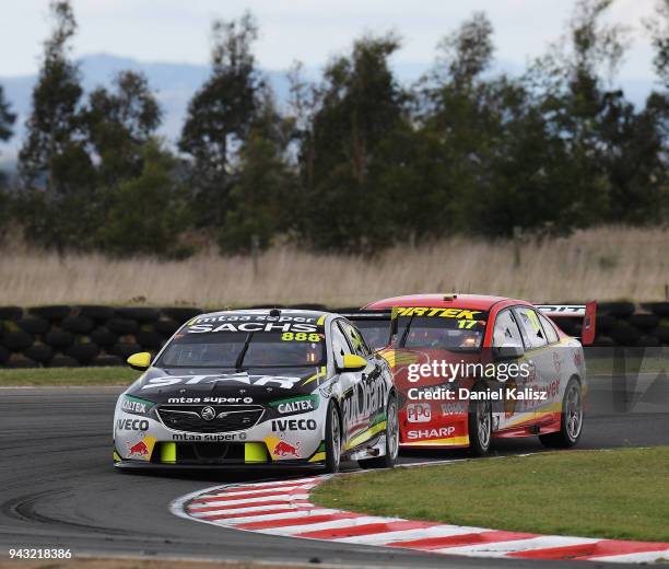 Craig Lowndes drives the Autobarn Lowndes Racing Holden Commodore ZB leads Scott McLaughlin drives the Shell V-Power Racing Team Ford Falcon FGX...