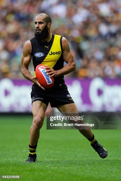 Bachar Houli of the Tigers runs the ball during the round three AFL match between the Richmond Tigers and the Hawthorn Hawks at Melbourne Cricket...