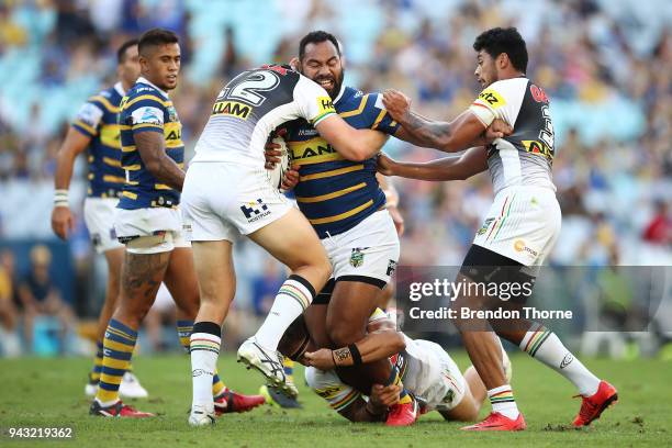 Tony Williams of the Eels is tackled by the Panthers defence during the round five NRL match between the Parramatta Eels and the Penrith Panthers at...