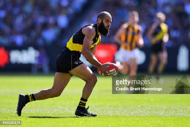 Bachar Houli of the Tigers runs the ball during the round three AFL match between the Richmond Tigers and the Hawthorn Hawks at Melbourne Cricket...