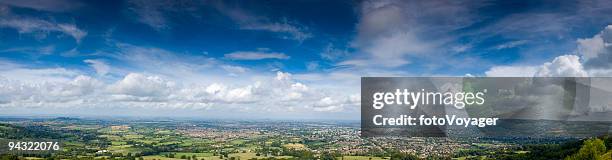 big sky, town, green fields - english high street stock pictures, royalty-free photos & images