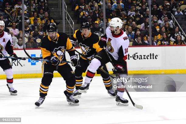 Tom Pyatt of the Ottawa Senators tries to avoid the puck against the Pittsburgh Penguins at PPG PAINTS Arena on April 6, 2018 in Pittsburgh,...