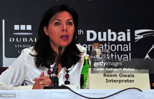 Interpreter Reem Owais speaks during the "Fix Me" press conference during day four of the 6th Annual Dubai International Film Festival held at the...