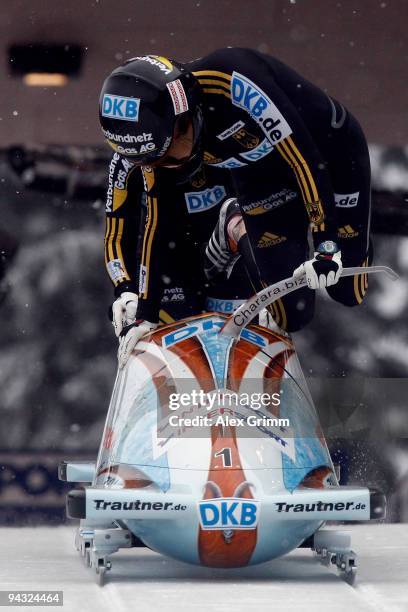 Pilot Sandra Kiriasis and Janine Tischer of Germany push off at the start in heat one of the women's bobsleigh competition during the FIBT Bob &...