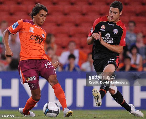 Adam Sarota of the Roar and Mathew Leckie of United compete for the ball during the round 18 A-League match between the Brisbane Roar and Adelaide...