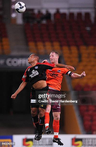 Cristiano of United and Craig Moore of the Roar compete for the ball during the round 18 A-League match between the Brisbane Roar and Adelaide United...