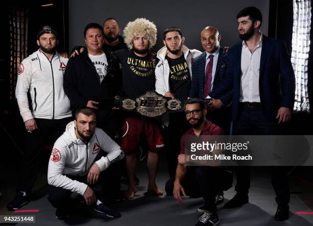 Khabib Nurmagomedov of Russia poses for a portrait backstage with his team after his victory over Al Iaquinta during the UFC 223 event inside...