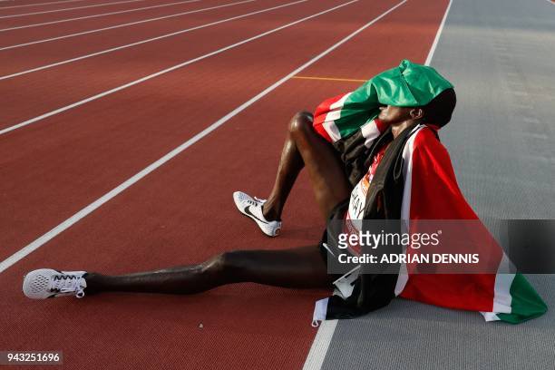 Kenyas Edward Pingua Zakayo celebrates after winning the bronze medal in the athletic's men's 5000m final during the 2018 Gold Coast Commonwealth...