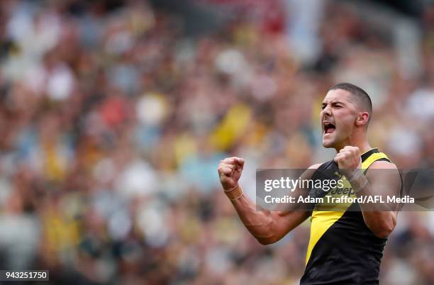 Shaun Grigg of the Tigers celebrates a goal during the 2018 AFL round 03 match between the Richmond Tigers and the Hawthorn Hawks at the Melbourne...