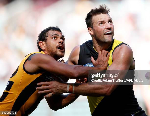 Cyril Rioli of the Hawks and Toby Nankervis of the Tigers compete in a ruck contest during the 2018 AFL round 03 match between the Richmond Tigers...