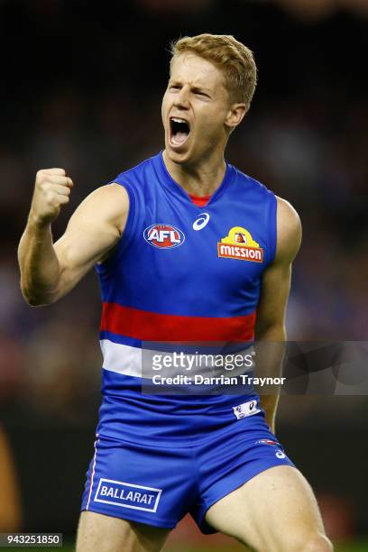 Lachie Hunter of the Bulldogs celebrates a goal during the round three AFL match between the Western Bulldogs and the Essendon Bombers at Etihad...