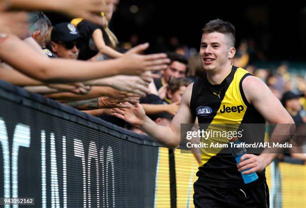 Debutant, Jack Higgins of the Tigers thanks fans after his first win during the 2018 AFL round 03 match between the Richmond Tigers and the Hawthorn...