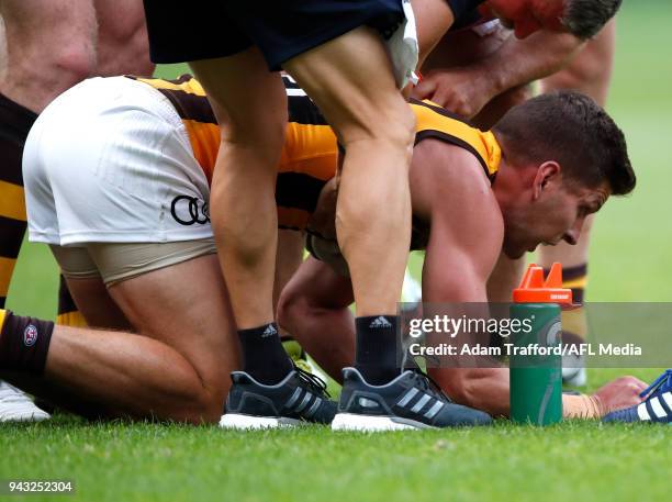 Luke Breust of the Hawks is seen on the ground after a late knock from Alex Rance of the Tigers during the 2018 AFL round 03 match between the...