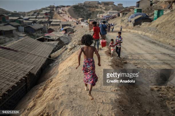 Rohingya children walk around at Kutupalong refugee camp in Maynar Guna, near Cox's Bazar, Bangladesh on April 07, 2018. Rohingya people, who fled...