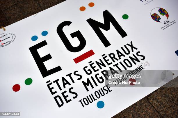 Banner reading 'Etats généraux des Migrations' ie 'Estates General of Migration'. People demonstrated against the planned law on 'Asylum and...