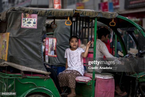 Girl rides in a three-wheelers in Cox's Bazar, Bangladesh on April 06, 2018. Three-wheelers are commonly used as the city faces a heavy traffic...