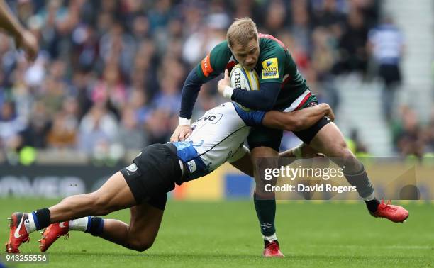 Mathew Tait of Leicester is tackled by Jonathan Joseph during the Aviva Premiership match between Bath Rugby and Leicester Tigers at Twickenham...