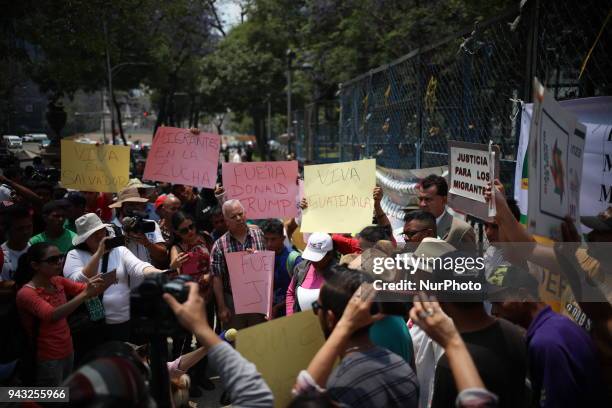 Group of Central American migrants, part of the the annual Stations of the Cross caravan march for migrants' rights, during a protest in Mexico City,...