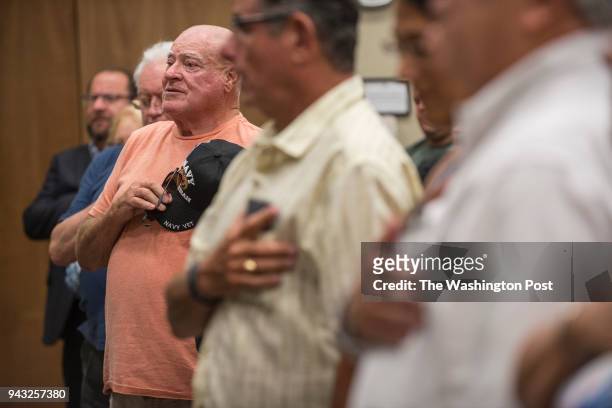 Reynold Bassett recites the Pledge of Allegiance during a town hall meeting with U.S. Rep Brian Mast hosted by Concerned Veterans for America in Palm...